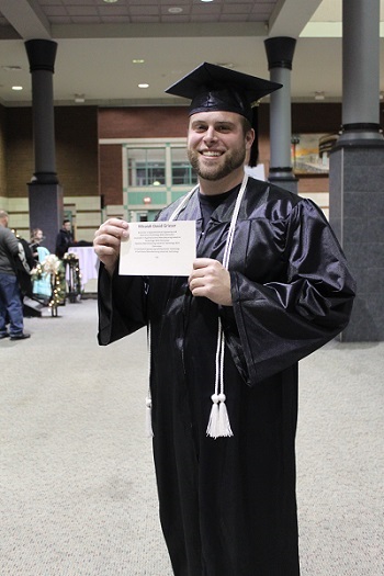 Mac Grieser with his diploma