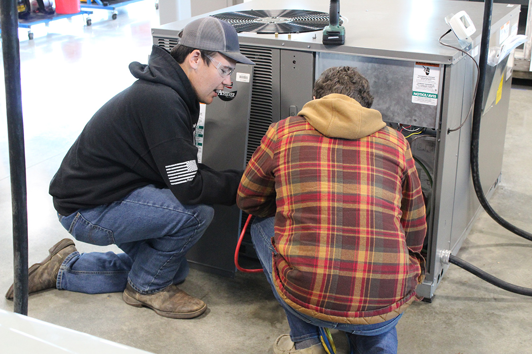Students working on a HVAC system. 