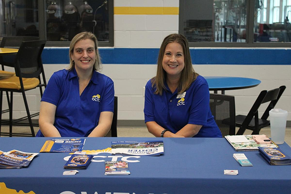 OCTC staff members sitting at a table. 