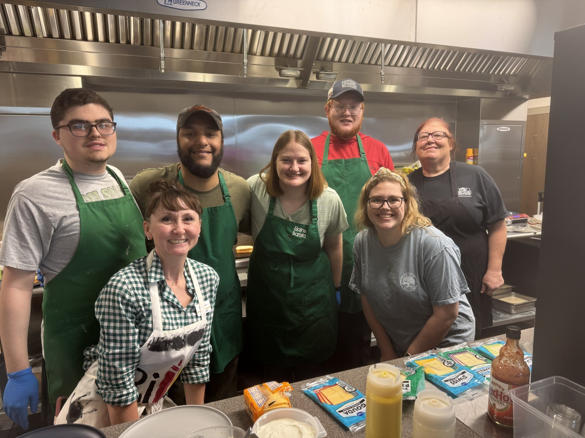 OCTC Life Skill students and staff in a kitchen.