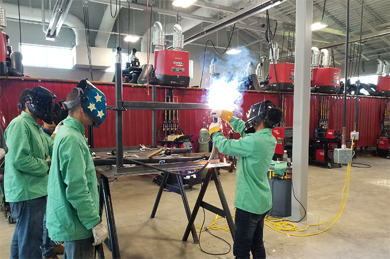 Students practicing welding. 