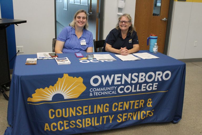 OCTC staff members sitting at a table. 